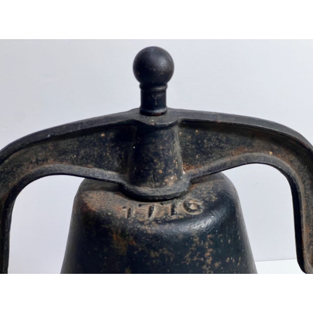 Late 19th century large cast-iron American bell featuring the commemorative date 1776 on the top. The bell's utilitarian...