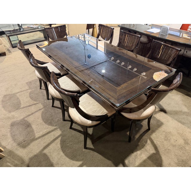 A striking embodiment of Italian modernism, this dark lacquer dining set by Pietro Costantini captures the bold...