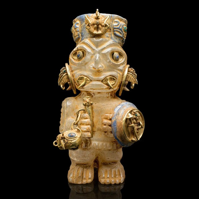This is a tall vintage tribal figure. A South American, carved crystal and gilt metal decorative totemic ornament, dating...