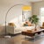 The lamp that lights a whole seating area without a single hole in your ceiling. Black nickel paired with a white marble...