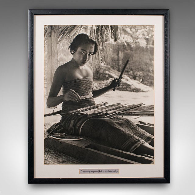 This is a vintage monochrome photograph of a loom weaver. An Oriental, framed large format black & white portrait, dating...