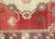 Handwoven wool-on-wool Oushak rug from vintage Turkey, measuring 4'8" x 9'5". Originating from the storied weaving...