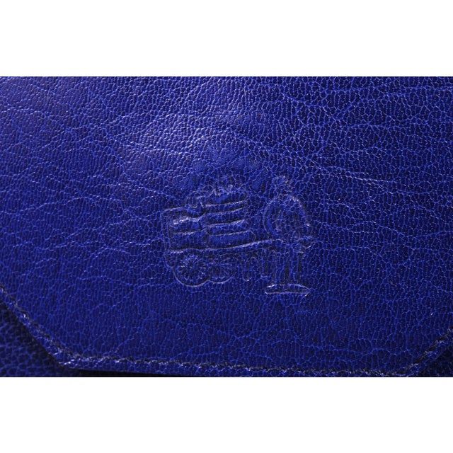 La Bagagerie is known for chic and stylish bags Made in France. This bright electric blue envelope clutch is a great...