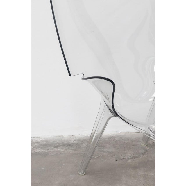 A pair of "uncle jim" armchairs, designed by philippe starck for kartell in 2014. made from a single injection mold of...