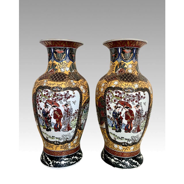 A pair of fabulous Japanese Satsuma style export vases with intricate hand painted scenes of Japanese geishas or...
