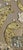 A pair of birds nestled in fantasy foliage executed in shells and gold leafed elements. The circumference is bound by a...
