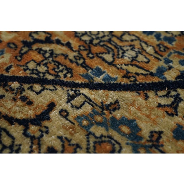 This is a classic pre-WWI NW Persian urban fine weave carpet with a "bookcover" design of allover small Herati motives...
