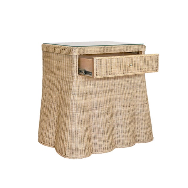 New item. Made from woven rattan, the Giselle Side Table features a flared scalloped base with one drawer for simple...
