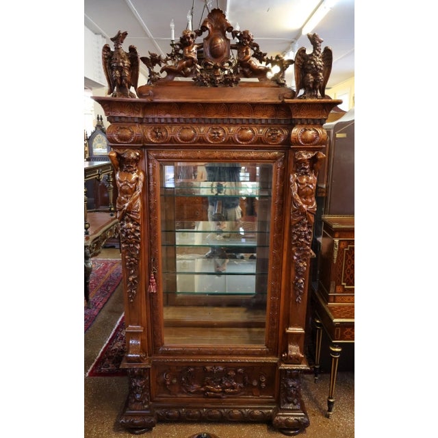 19th Century Renaissance Revival Atlas Walnut Figural Curio China Cabinet Dimensions : 52" Wide X 23" Deep X 102" Tall...