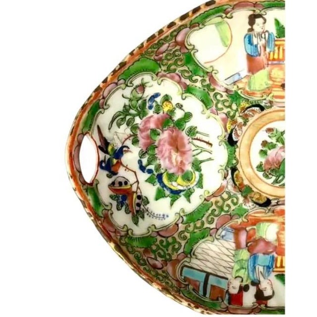 Chinese Famille Rose Porcelain Oval Trinket Bowl with pierced handles at each end. Bowl is hand-painted with Chinese court...
