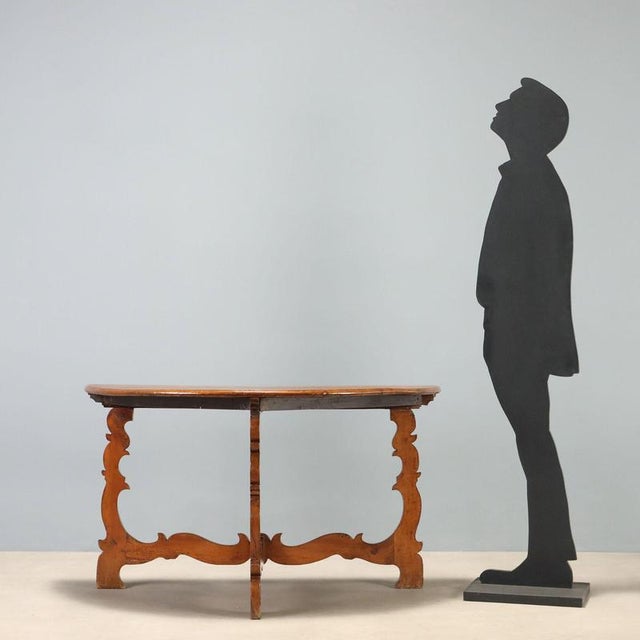 Baroque walnut console dating back to the early 18th century, originating from Italy. The design features a half-moon top,...