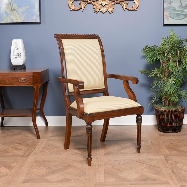 The set of Tall Back Upholstered Chairs by Niagara Furniture consists of 2 armchairs and 8 matching side chairs. The...