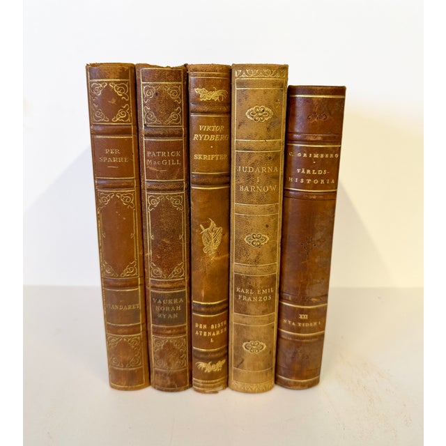 Set of four Swedish and one German leather bound books with marbleized covers dating to 1928/29. Beautiful age and patina...