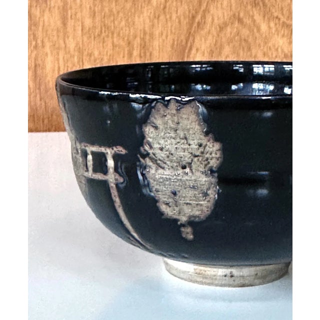 A Japanese chawan (tea bowl) of Kyo-yaki (Kyoto ware) attributed to Nin'ami Dōhachi, also known as Takahashi Dōhachi...