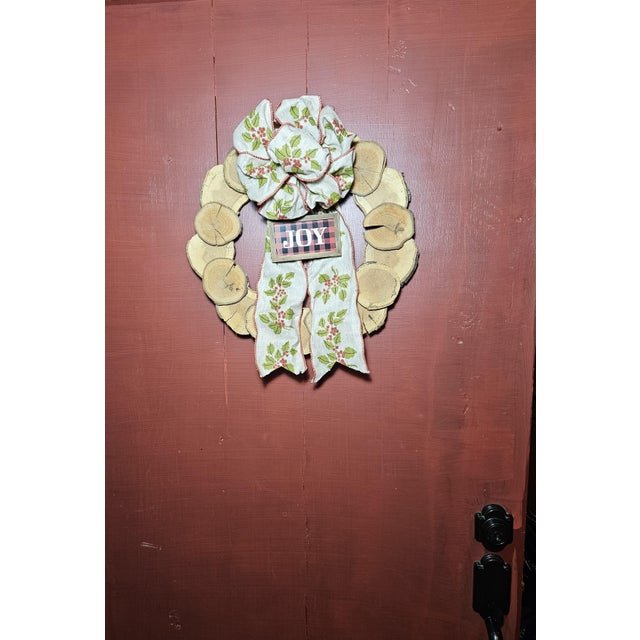 Celebrate the season with this beautifully handcrafted holiday wreath made from genuine oak tree wood slices, each...