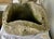 A sculptural pair of hand-carved stone planters, each hewn from solid natural stone and showcasing beautifully irregular,...