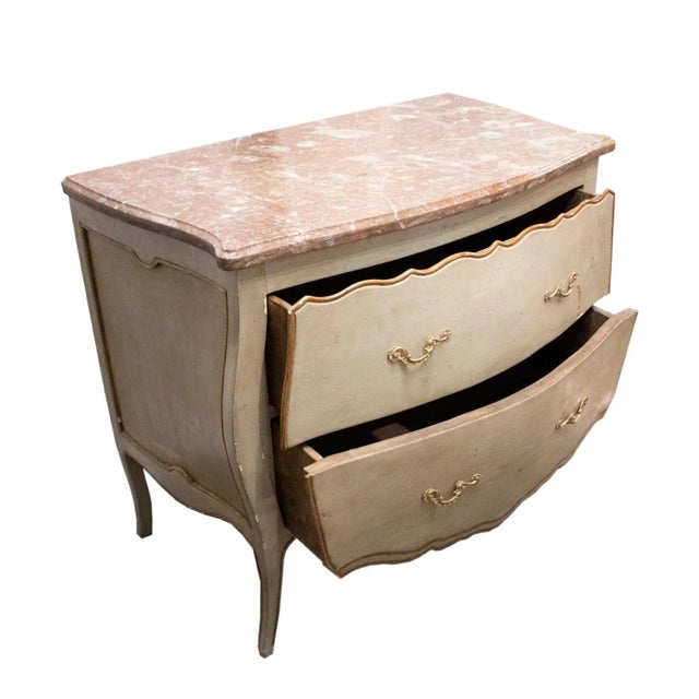 Two-drawer chest in Italian Rococo style, made of linden and oak wood, handcrafted, polychromed in green with gold leaf...