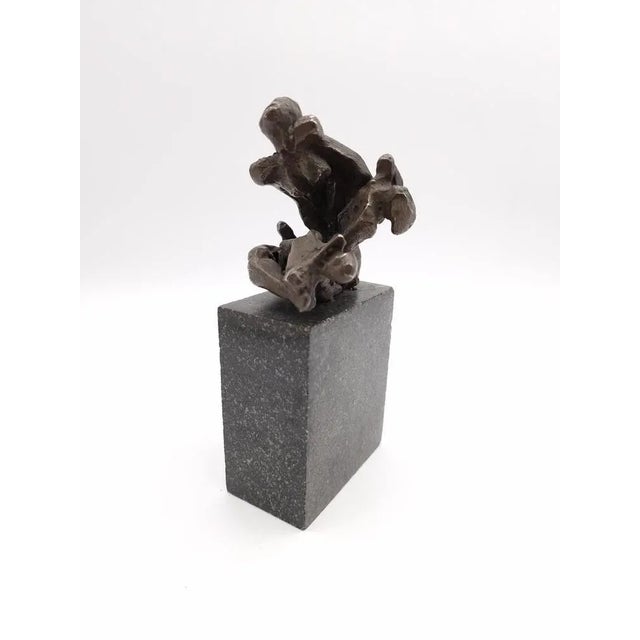 Contemporary sculpture depicting motherhood. Work signed but illegible. Beautiful patina on it. Unique piece on marble...