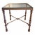 Vintage Giacometti style wrought iron side table in a brushed gray finish with thick glass top. The frame is detailed with...