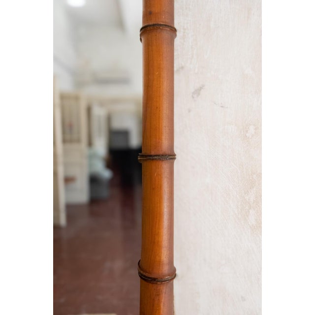 Turned Wood Faux Bamboo Mirror – 1940s Wall mirror with a rectangular turned wood frame in a faux bamboo finish.