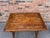 This is an amazing early 19th century French solid wood table with lovely details from the solid stretch bar legs accented...