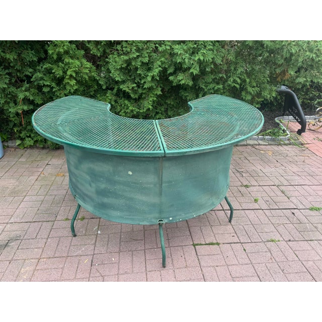 Charming vintage outdoor table featuring a circular green-painted metal mesh top with a distinctive curved cutout, split...