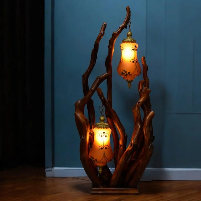 Sinuous ribbons of wood writhe in a beautiful bouquet punctuated with an amber glow... capturing the magic of the forest....
