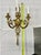 Elegant Louis XVI-style three-light wall sconce in cast gilt brass, decorated with ribbon, bow, and tassel motifs in the...