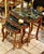 Elegant Rococo style nesting tables featuring a luxurious set of three accent tables topped with sophisticated black...