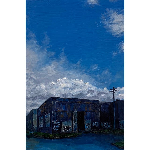 Western Street by Stephanie Buer | Oil on panel Painting of an industrial building under a blue sky For Sale