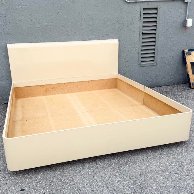 Bed frame interior: 77.5”w, 81”d, 11.5”h Headboard: 79.25”w, 3.75”d, 42.25”h This postmodern king size bed frame brings...