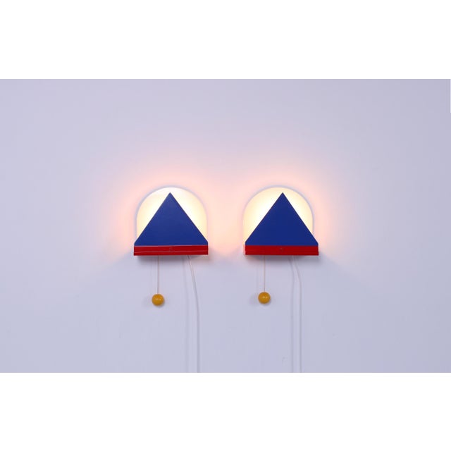 Very characteristic 1980s 1990s style colored wall lamps by Ikea. Nice vintage details which reminds to the work of...