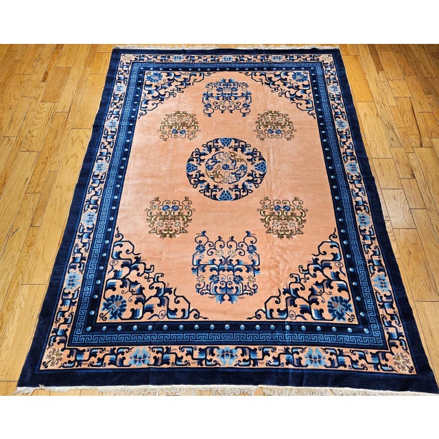 This beautiful Art Deco-style Chinese rug from the second quarter of the 20th century features a soft pale pink and...