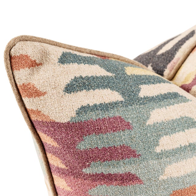 Infused with a playful palette of coral, blush, teal, and mustard, this fabric features a modern, stepped pattern that...