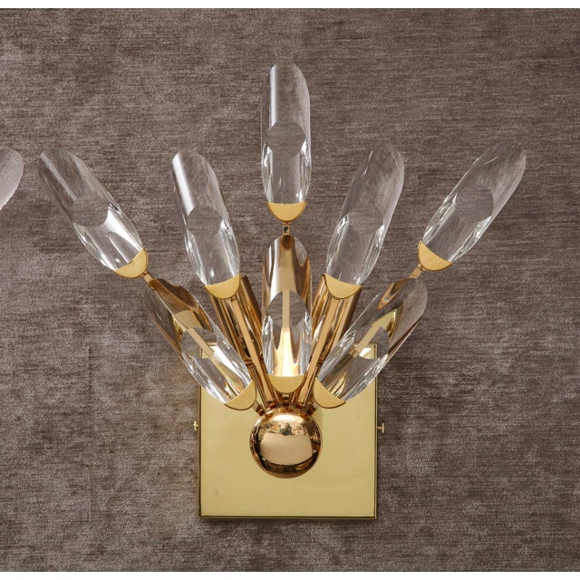 Beautiful pair of Crystal and Brass Sconces by Oscar Torlasco. The polished brass fixture holds eight Crystal elements...