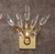 Beautiful pair of Crystal and Brass Sconces by Oscar Torlasco. The polished brass fixture holds eight Crystal elements...