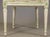 A very decorative sturdy French side or desk chair. With foliate carved ribbons. Painted in off white with pale green...