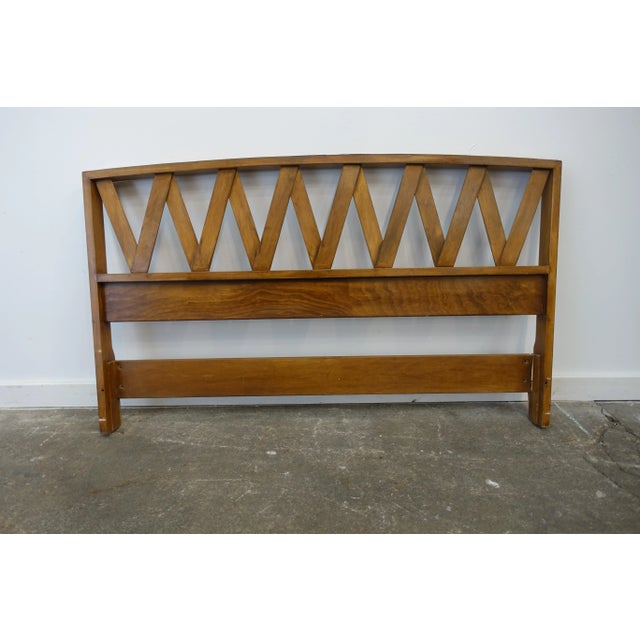 This headboard is designed by Paul Frankl and is a full size headboard. It is in good vintage condition. There are breaks...