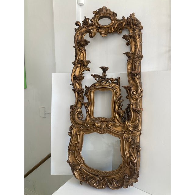 18th Century French Louis XV Gilt Carved Wood Wall Shelf with 14 Porcelain Stands. Moveable closing glass door at the...