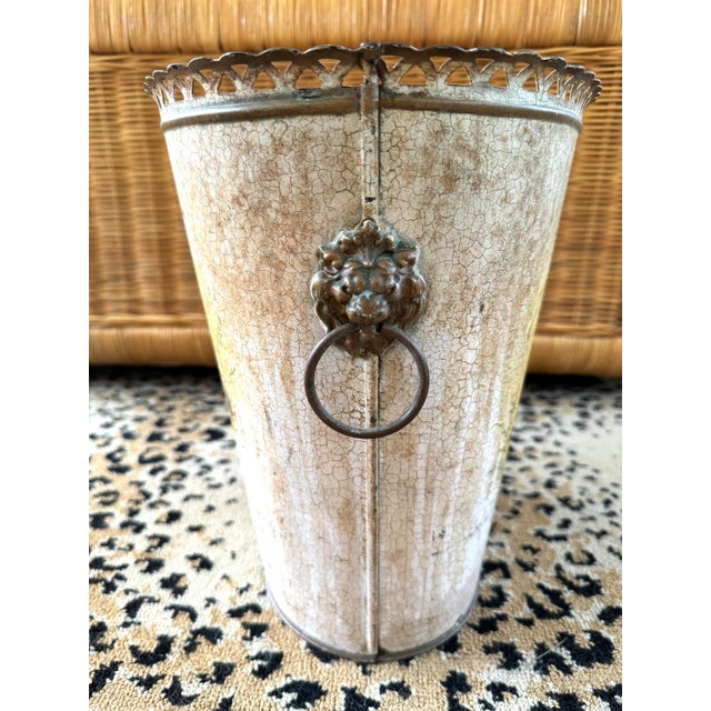 Vintage tole Chinoiserie wastebasket. Hand painted. Different design to each side. Filigreed top. Brass lion head with rings.
