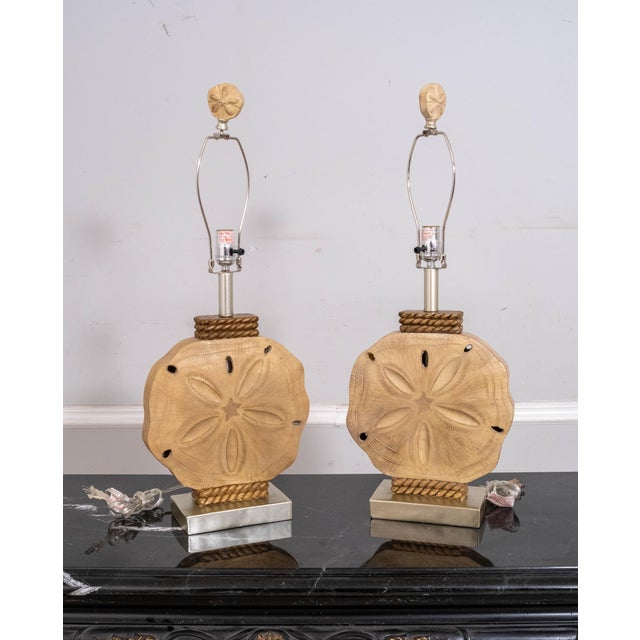 Age: Approx 30 years old Details: Tall table lamps representing sand dollars with shell accents perfect for nautical...