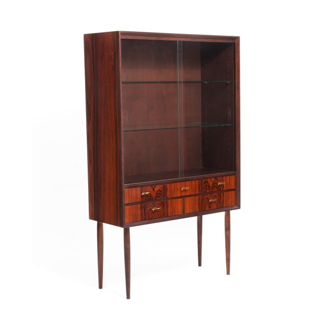 An absolutely stunning rosewood vitrine by Svante Skoch for Seffle Möbelfabrik, Sweden from the series Cortina, 1960s. The...