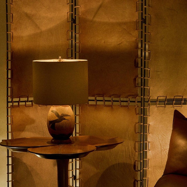 Sourced in Paris, a French Art Deco table lamp from the 1940s carved in wood with a rounded silhouette and hand-worked...