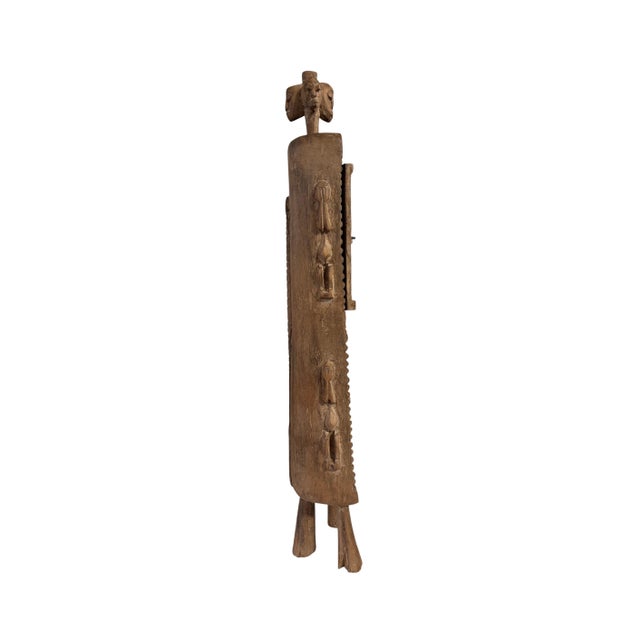 Superb and unique hand-carved wooden box from the Dogon tribe of Mali, featuring a double-door design traditionally used...