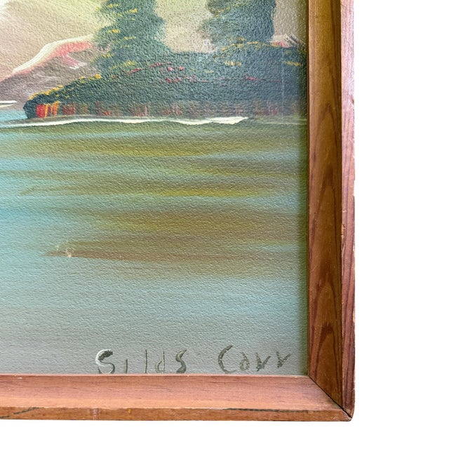 A charming mid-century folk art landscape painting depicting a rustic log cabin overlooking a serene mountain lake....