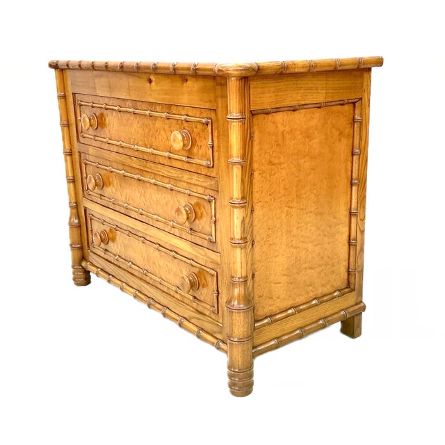 Birdseye Maple and Faux Bamboo Commode by Claude Prio. Commode is fitted with three substantial drawers, each framed in...