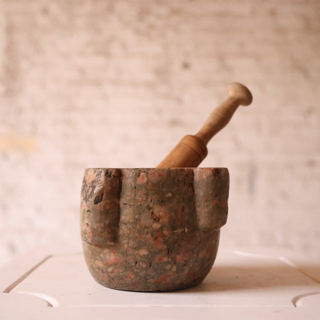 Add timeless rustic character to your space with this 19th century French stone mortar and pestle, a beautifully hand-...