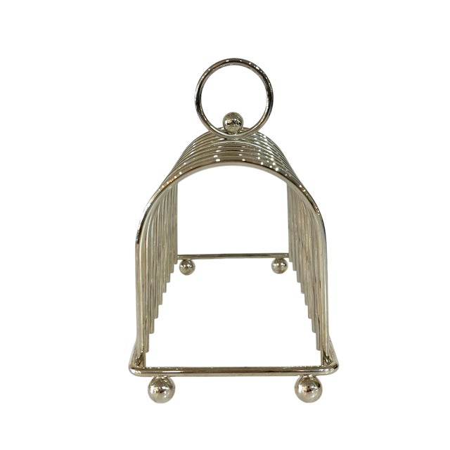 Larger size French Art Deco silver plate toast rack. Deco style round handle with ball detailing that matches the feet....