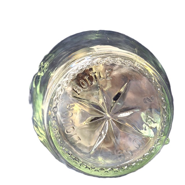 Elevate your bar cart with this striking Mid-Century Modern decanter, featuring a deeply embossed Atomic Starburst...