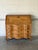 This bureau features a drop-front desk that opens to reveal an interior with small drawers and a central cubby. The lower...
